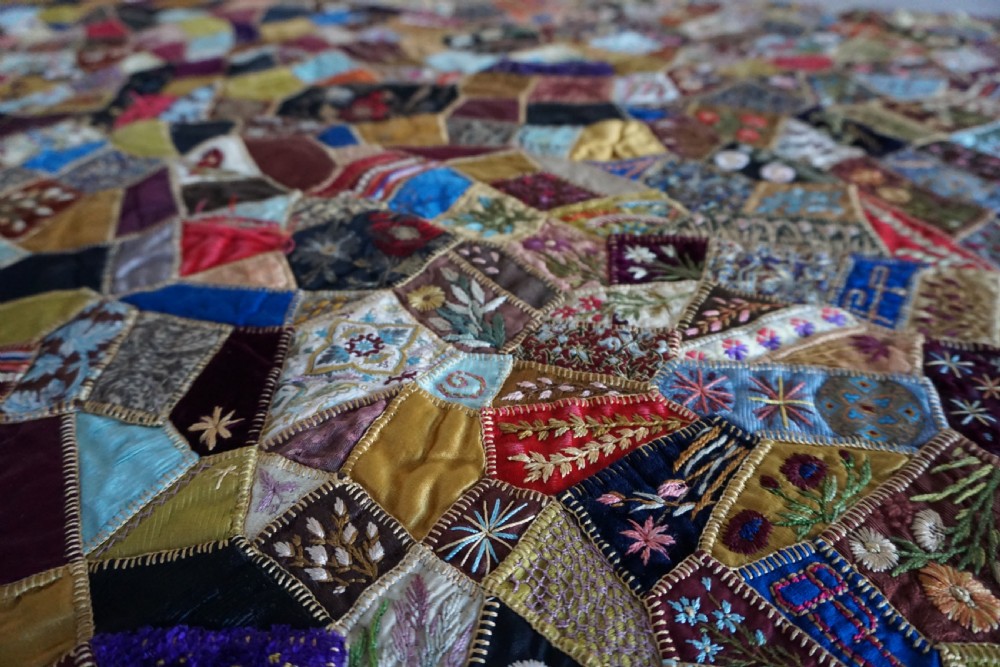 A fine Victorian Aesthetic 'crazy' patchwork parlour panel, comprising intricately hand-worked silk and velvet sections. View II