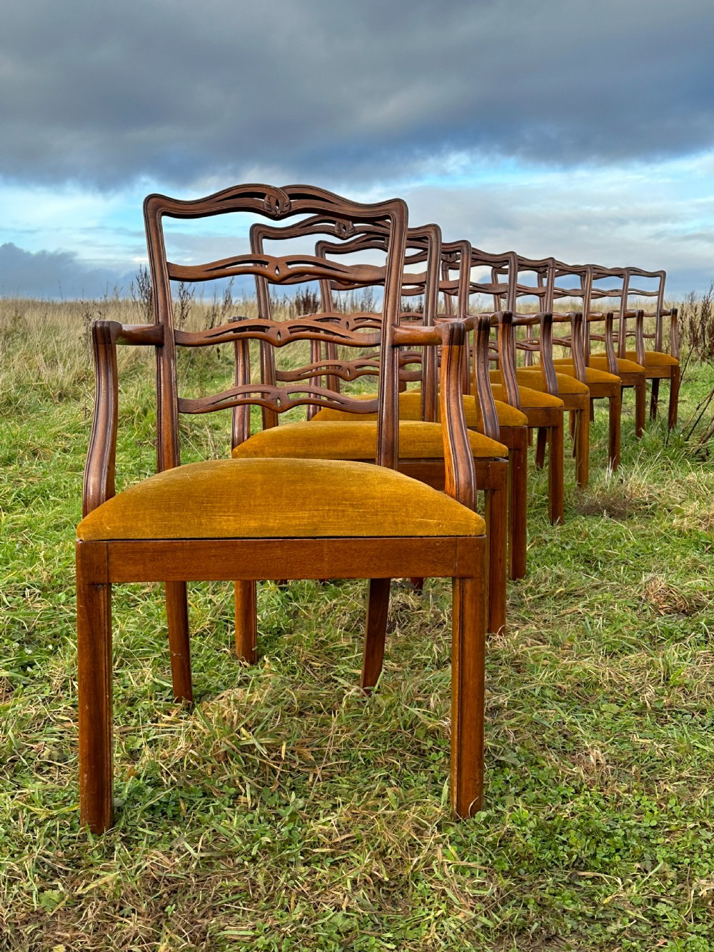 A set of eight mahogany ship's armchairs, from a British Ocean Liner c.1920