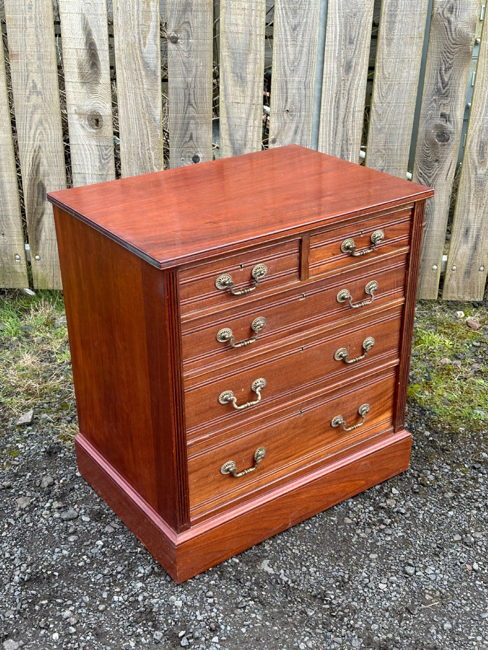 A small 19th century walnut chest of drawers, probably London made, c.1870 View V