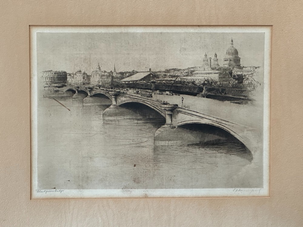 A monochrome drypoint etching depicting Blackfriars Bridge over the River Thames with St Pauls Cathedral visible in the London skyline.