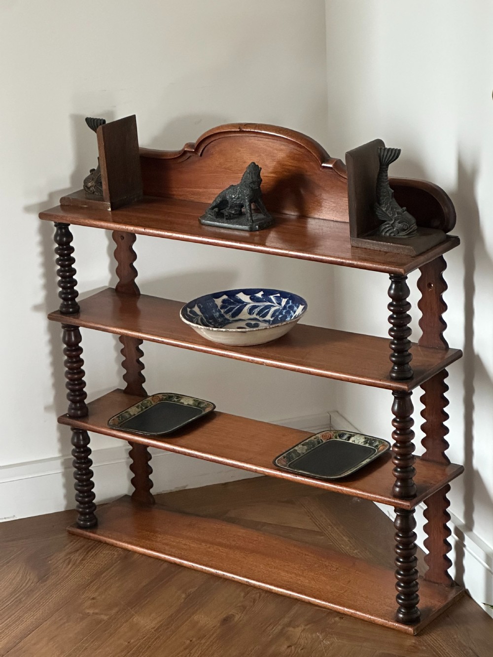 A mid-19th century mahogany set of shelves with bobbin supports View II