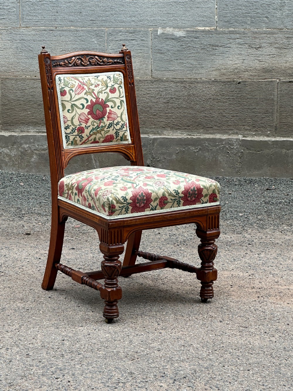 In the manner of Bruce Talbert (1838-1881) A carved walnut library chair, 1870's