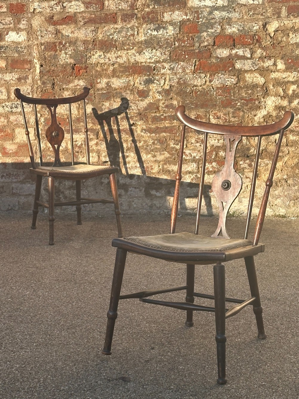A pair of Art Furniture mahogany side chairs in the manner of/ and quite possibly by the firm J S Henry, London and Glasgow c.1895 View II