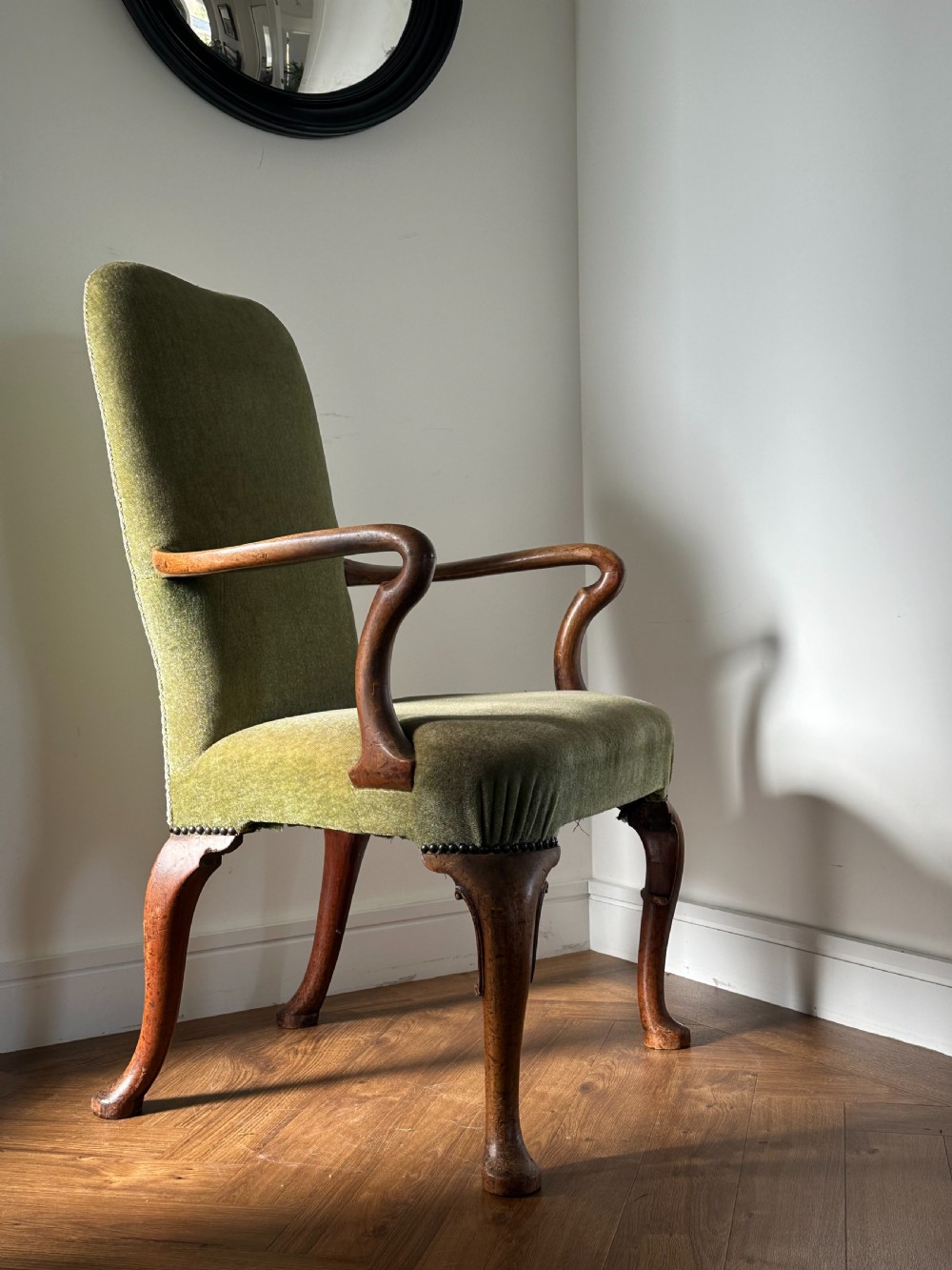 A George I carved walnut shepherd's crook armchair, c.1725