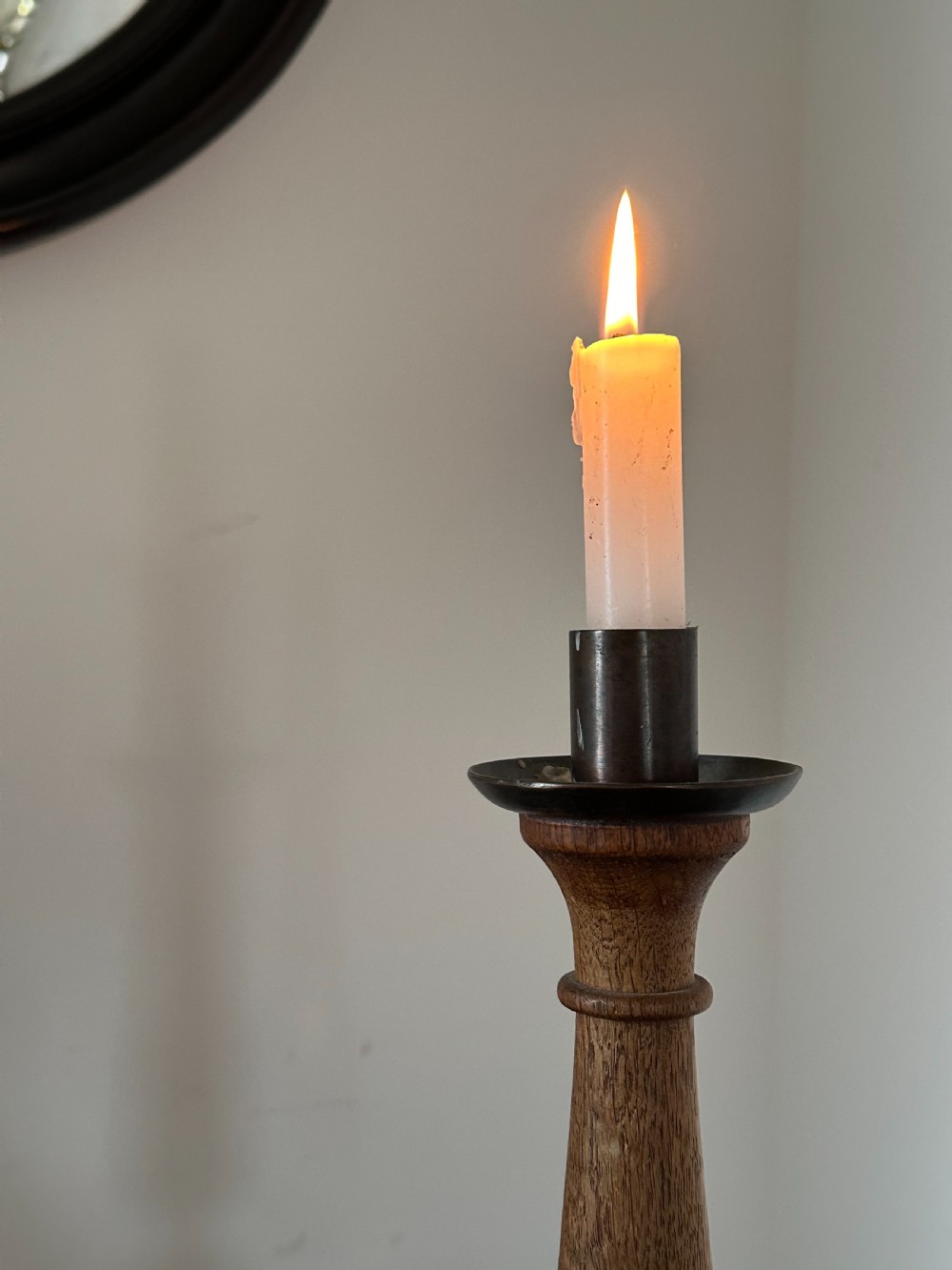 A pair of Arts and Crafts carved and turned oak candlesticks in the style of Sir Edwin Lutyens View III