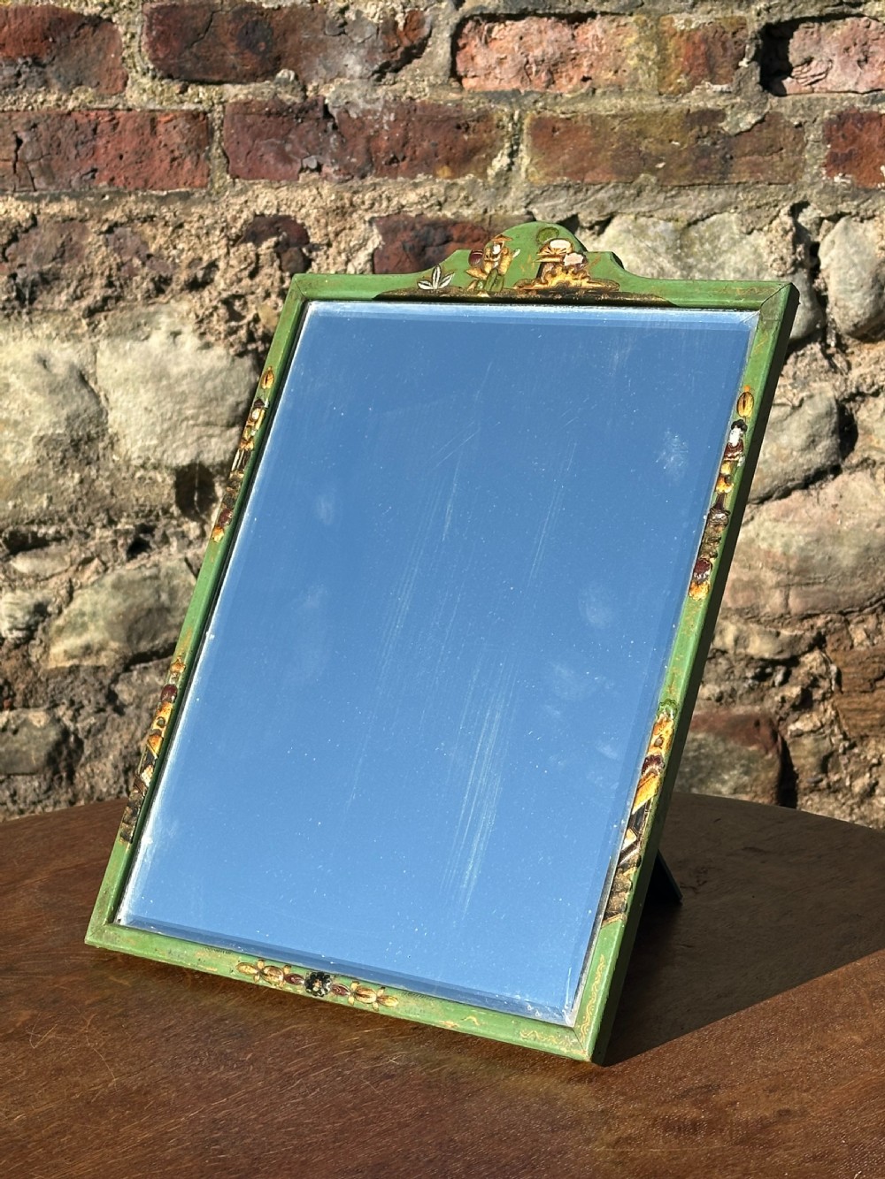 An apple-green lacquered and chinoiserie decorated easel mirror attributed to Whytock & Reid of Edinburgh