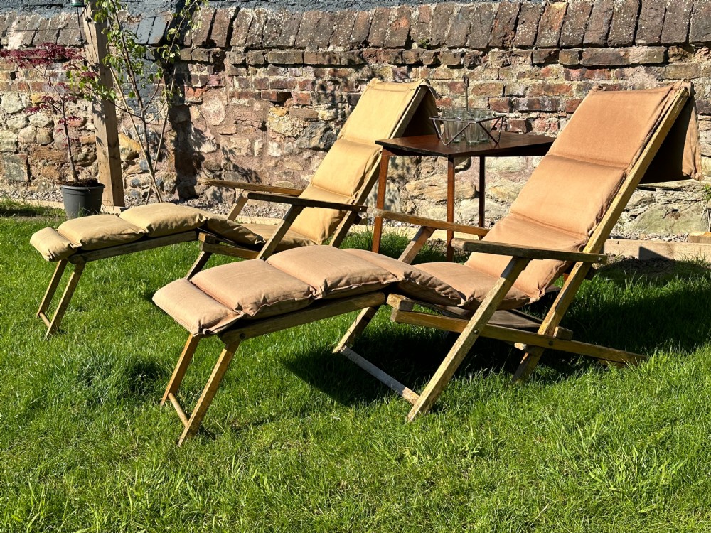 A rare pair of English beech and laminated beech ocean liner deck chairs