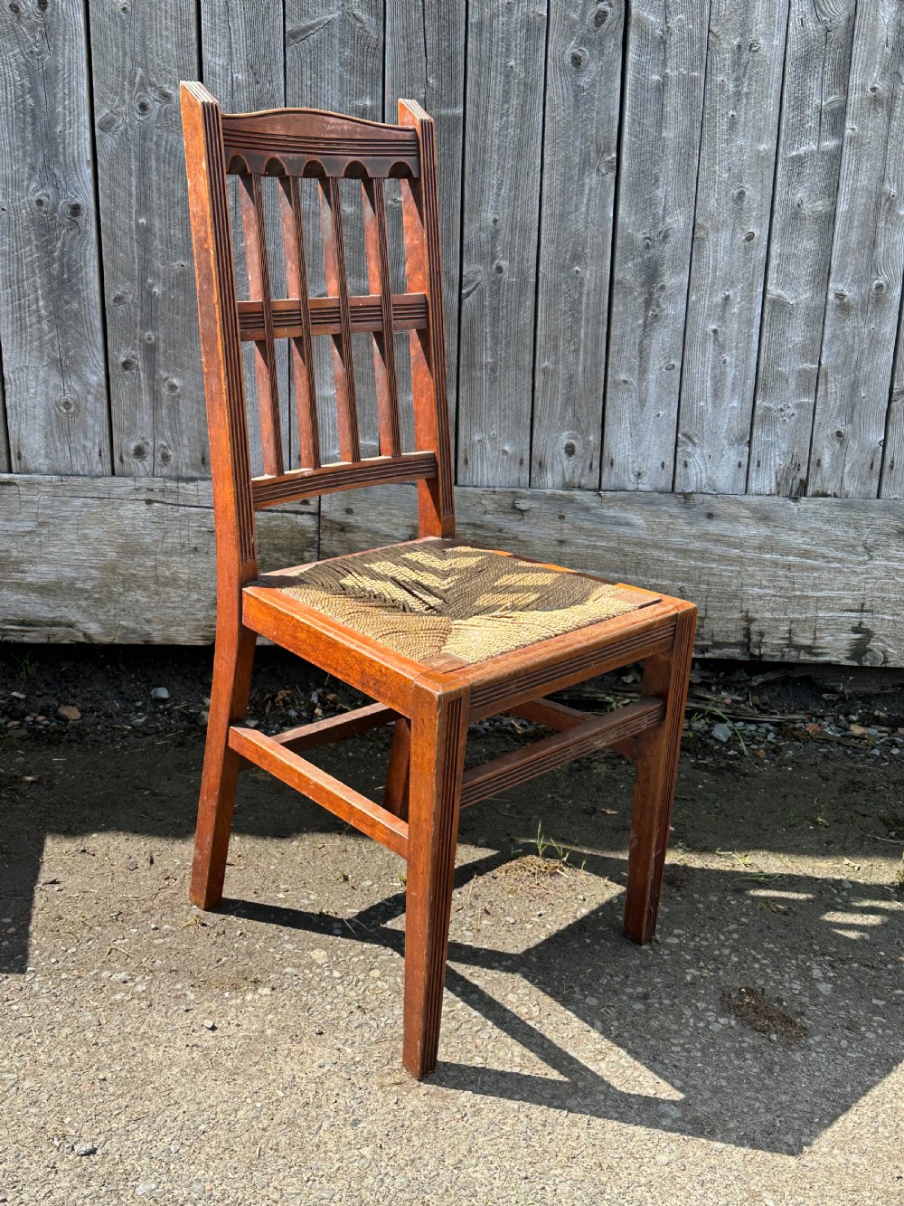 A set of eight Arts and Crafts walnut dining chairs in the manner of Philip Webb, 1860's View IV