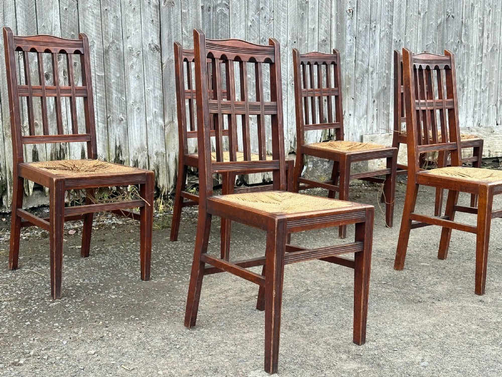 A set of eight Arts and Crafts walnut dining chairs in the manner of Philip Webb, 1860's View V