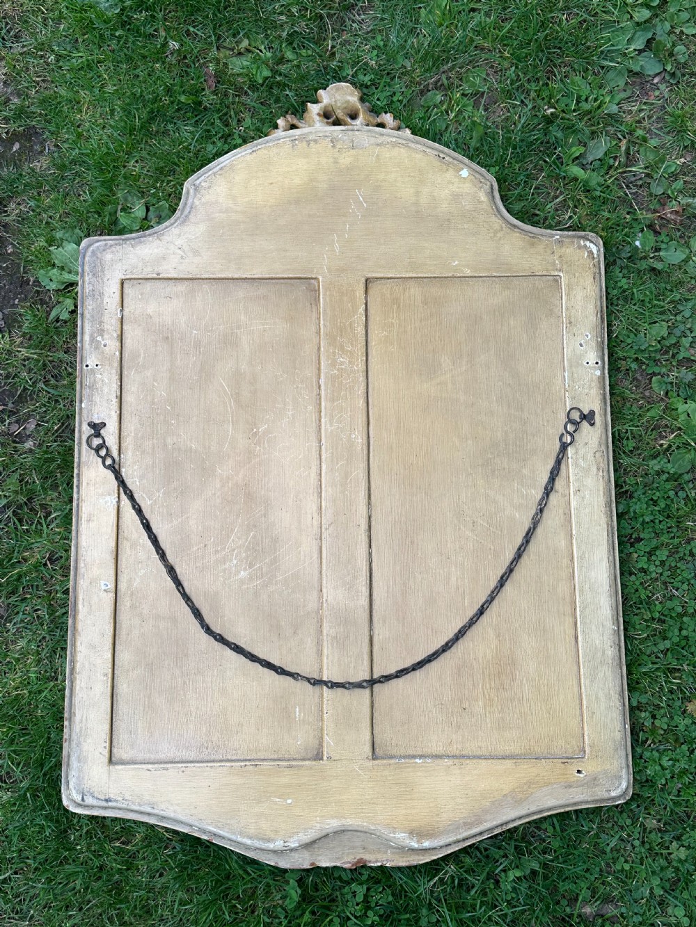 A chic 1920's cartouche-shaped wall mirror, probably by Whytock and Reid  View II
