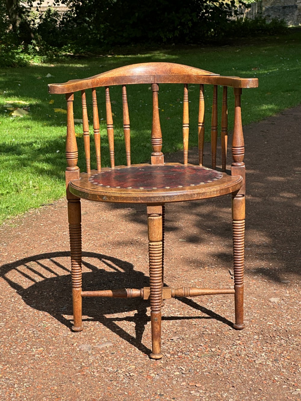 An Art Furniture walnut and leather upholstered chair, attributed to Liberty's / William Birch c.1900 View II
