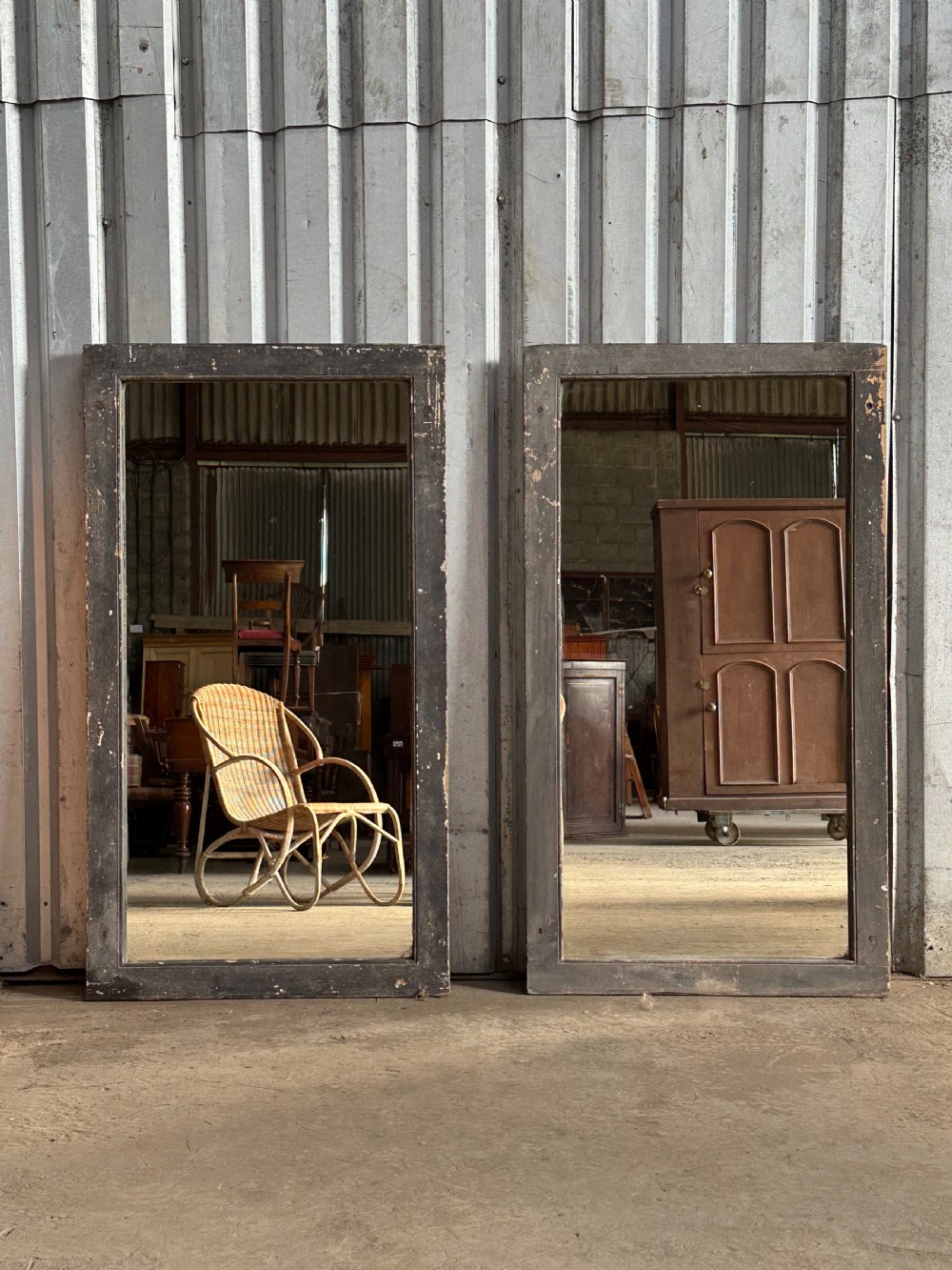 A pair of ebonised mirrors, c.1900 