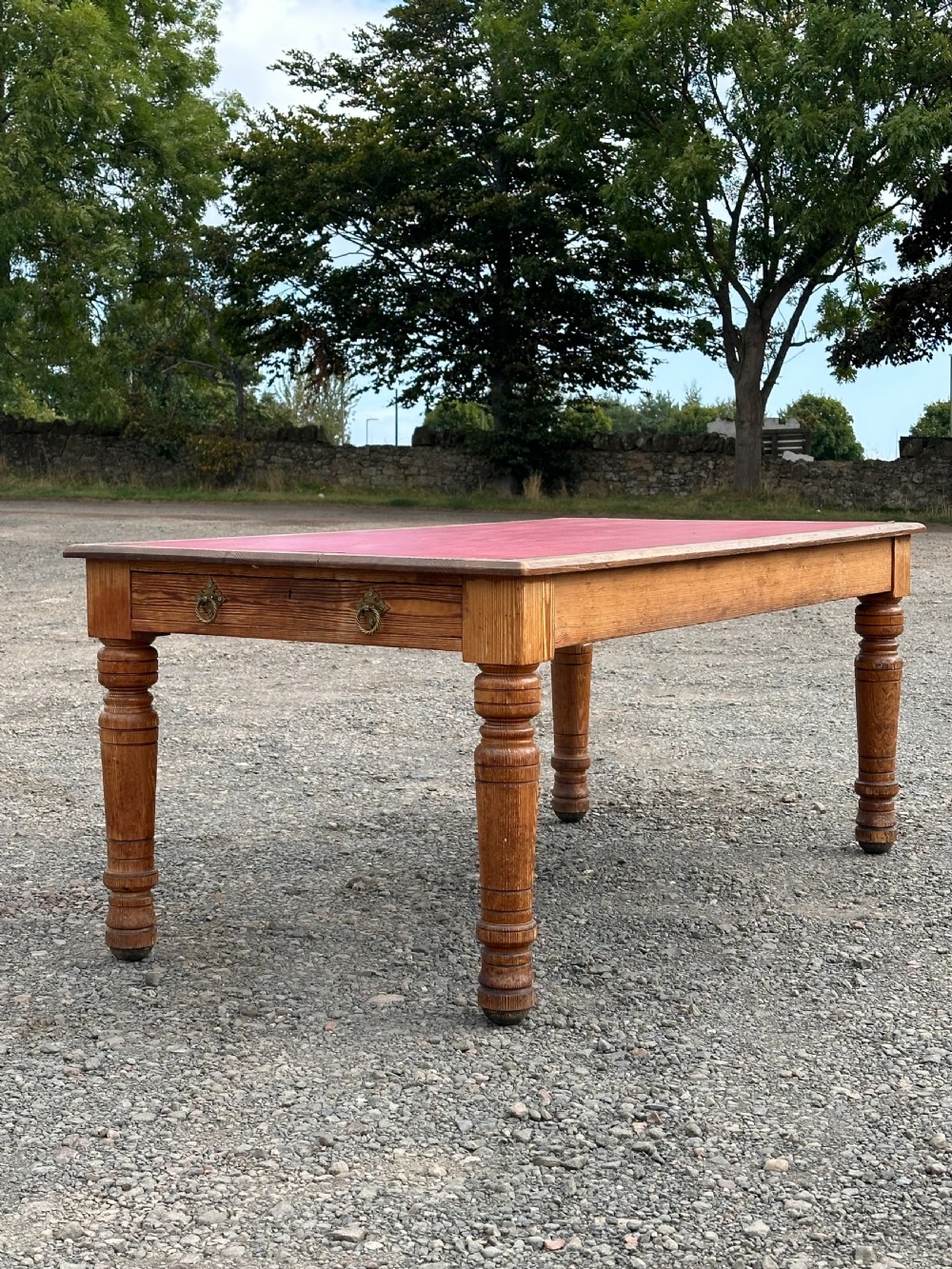A pitch pine library table in the Gothic Revival taste, c.1880