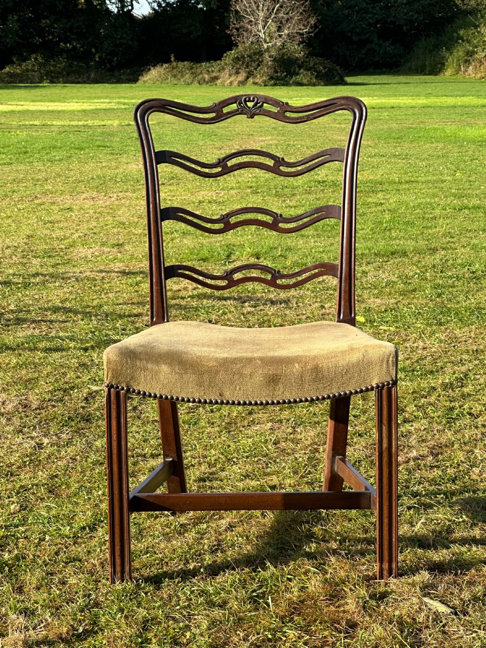 A smart set of four George III mahogany ladderback chairs, attributed to William Hamilton of Edinburgh, 1770's View II