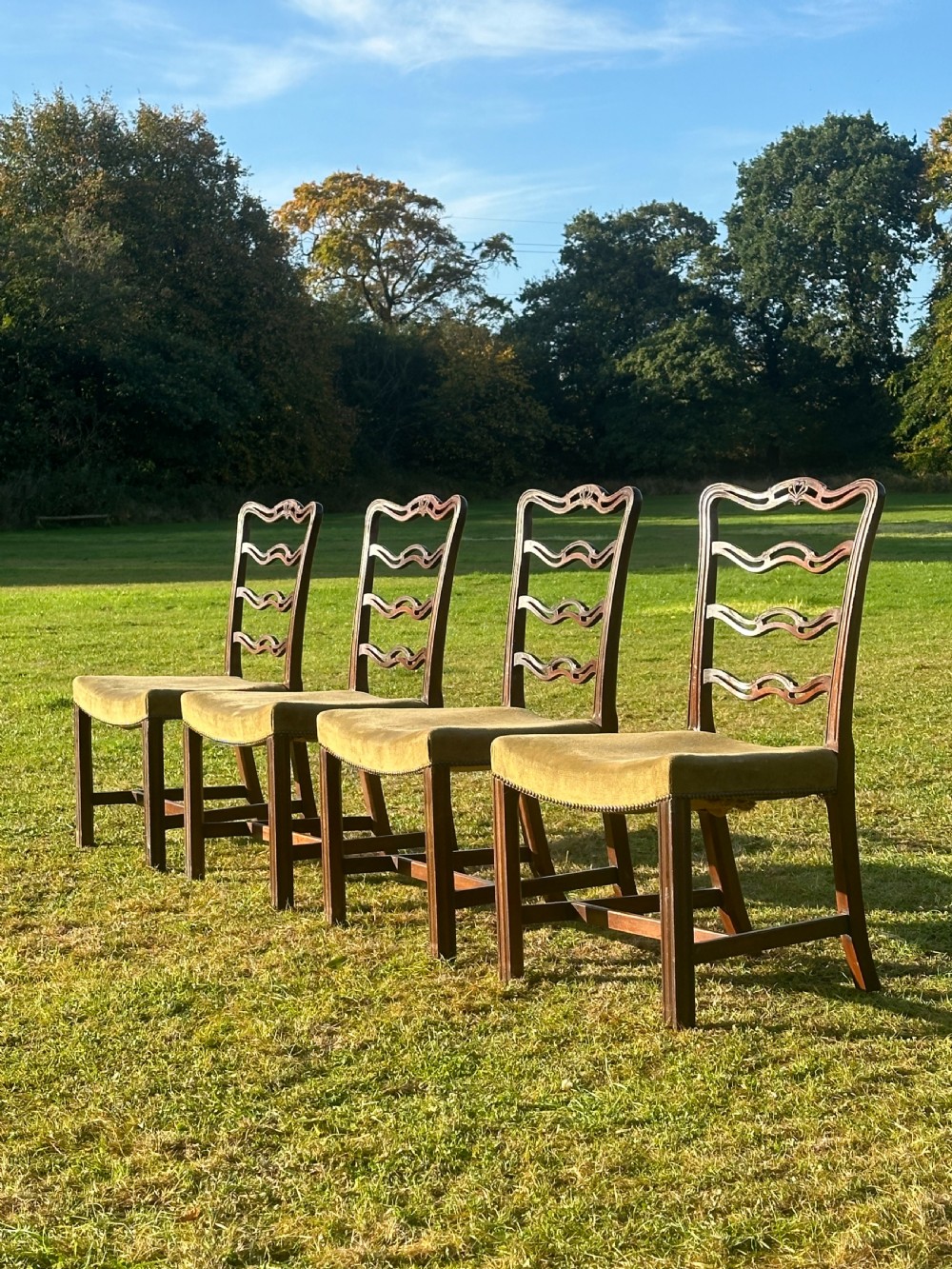 A smart set of four George III mahogany ladderback chairs, attributed to William Hamilton of Edinburgh, 1770's
