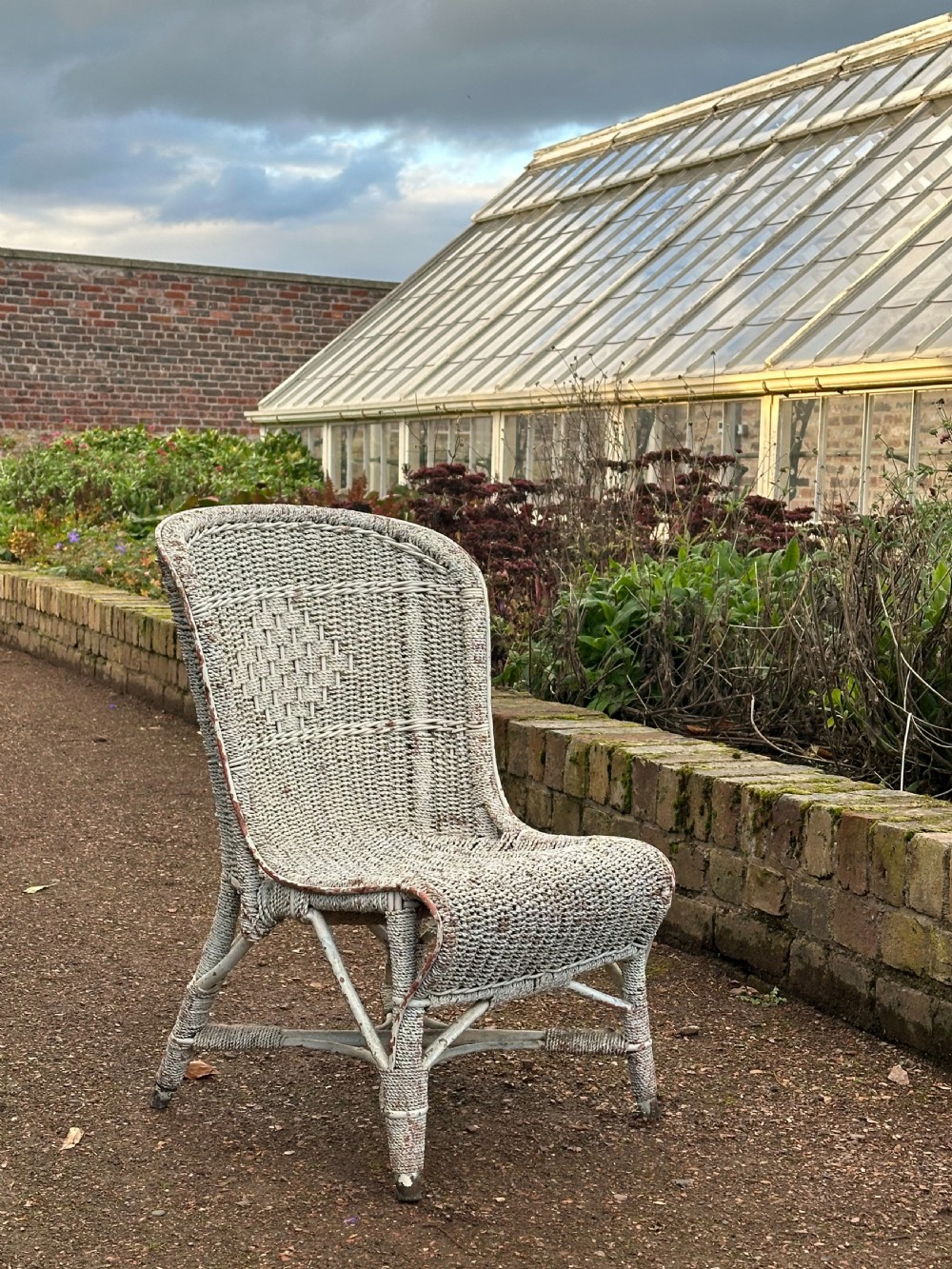 An unusual English cane and rope- work low chair, first quarter 20th century