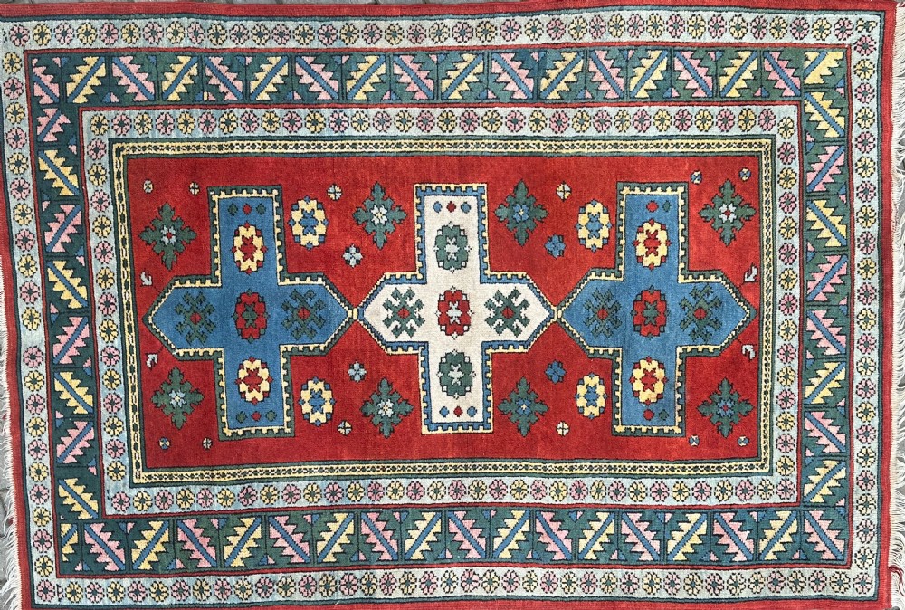 A hand-knotted Kazak rug