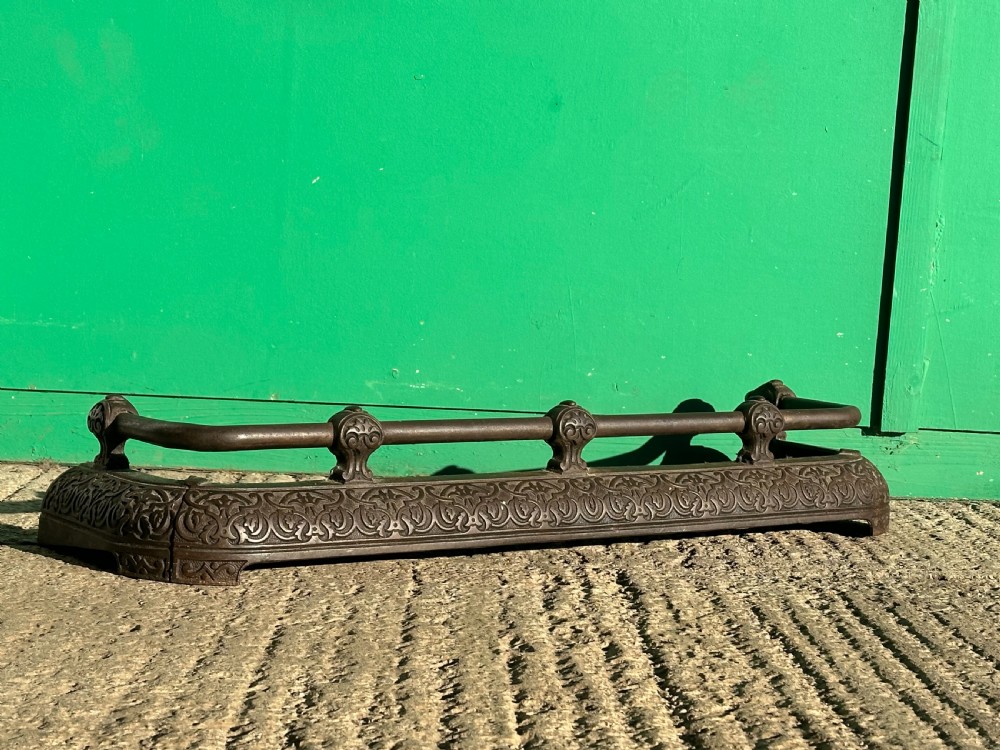 A Victorian cast iron fender, with Arabesque designs in the manner of Owen Jones, c.1860