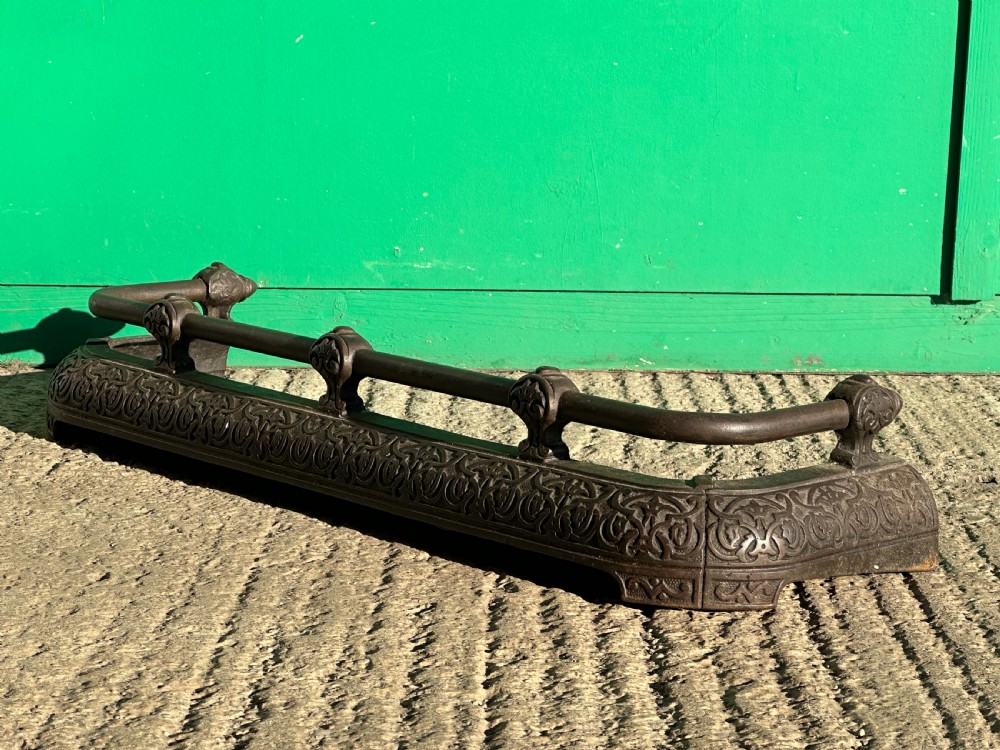 A Victorian cast iron fender, with Arabesque designs in the manner of Owen Jones, c.1860 View V