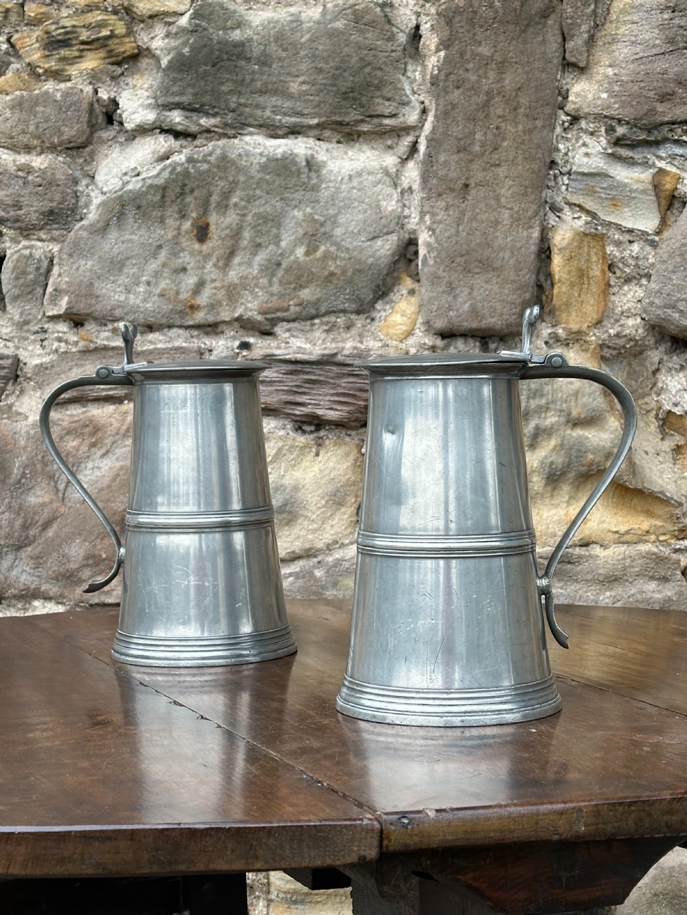 A pair of Scottish George III pewter flat-lidded flagons, c.1800