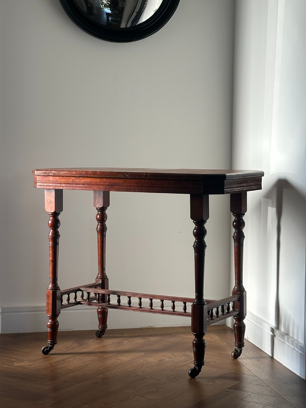 A classy walnut centre table made by William Hall (1838-1908), fourth quarter 19th century