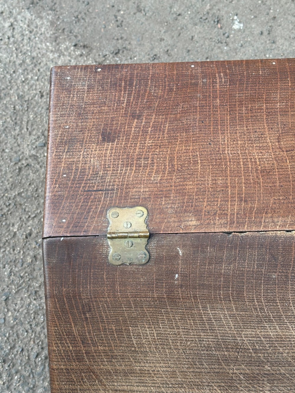 A Scottish George III period oak coal bunker featuring a slanted hinged lid with a dark turned wooden knob and brass strap hinges. View II
