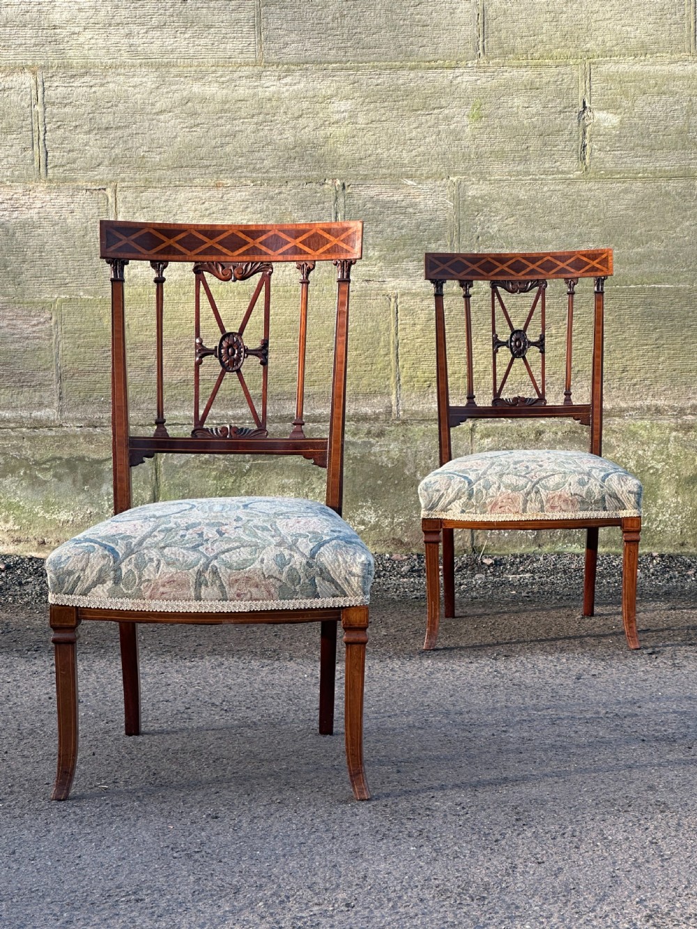 A fine pair of neoclassical low chairs in the manner of Collinson & Lock