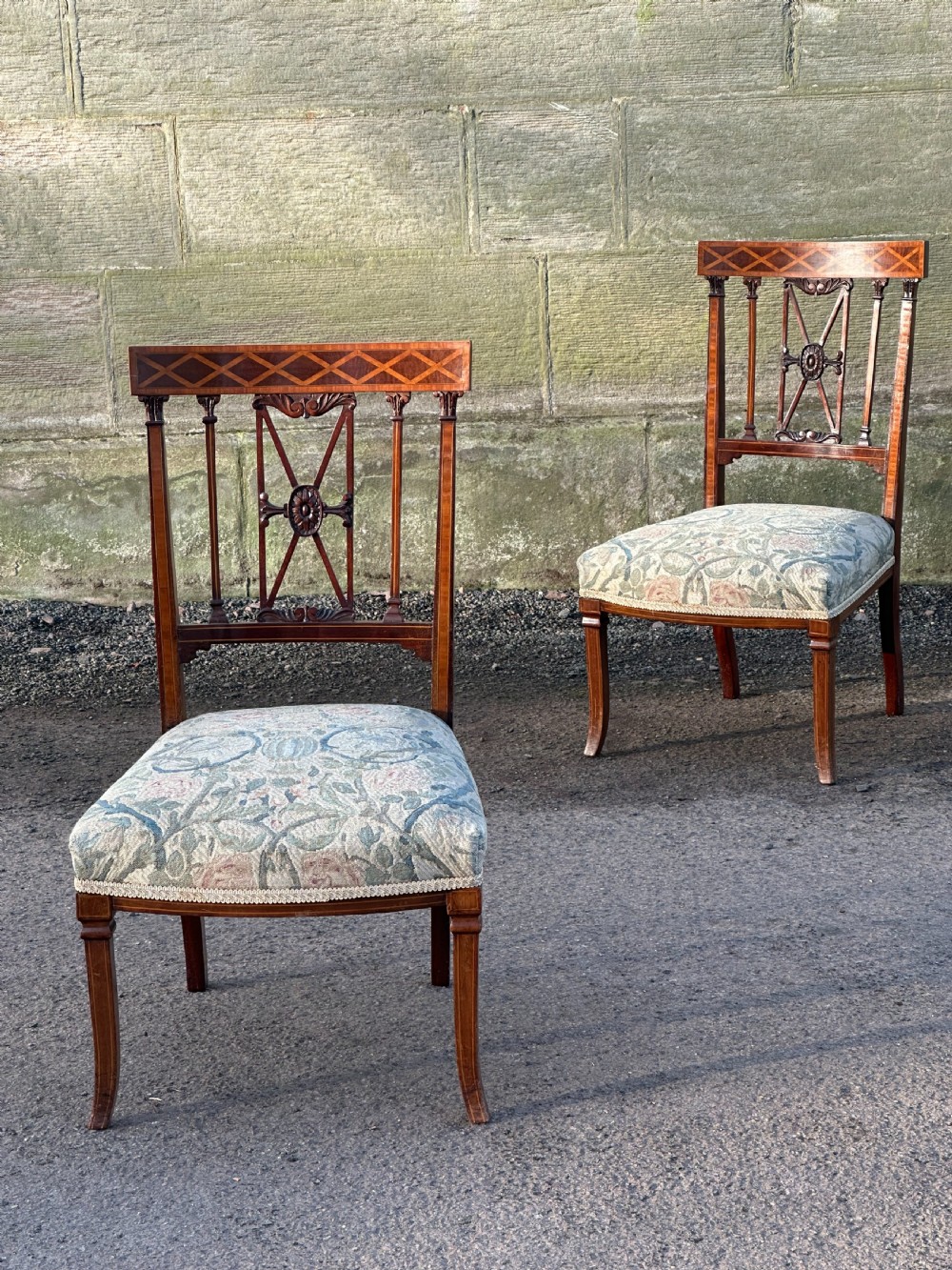 A fine pair of neoclassical low chairs in the manner of Collinson & Lock View III