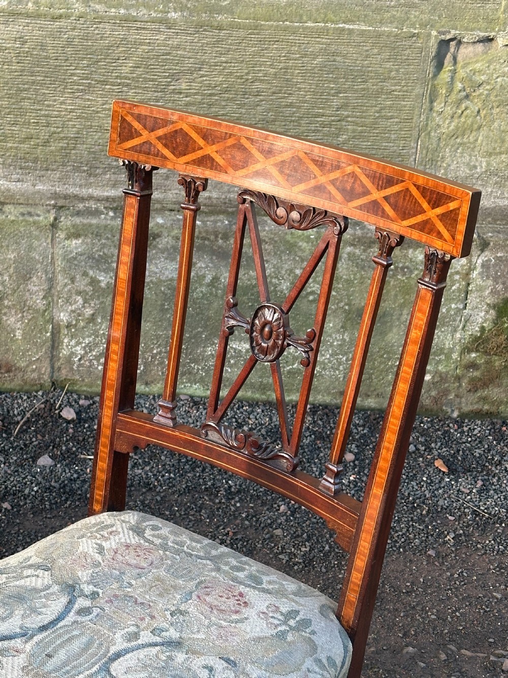 A fine pair of neoclassical low chairs in the manner of Collinson & Lock View IV