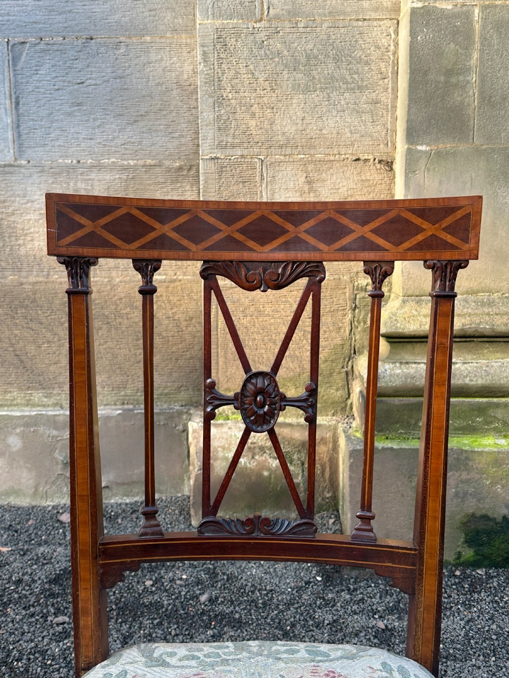A fine pair of neoclassical low chairs in the manner of Collinson & Lock View V