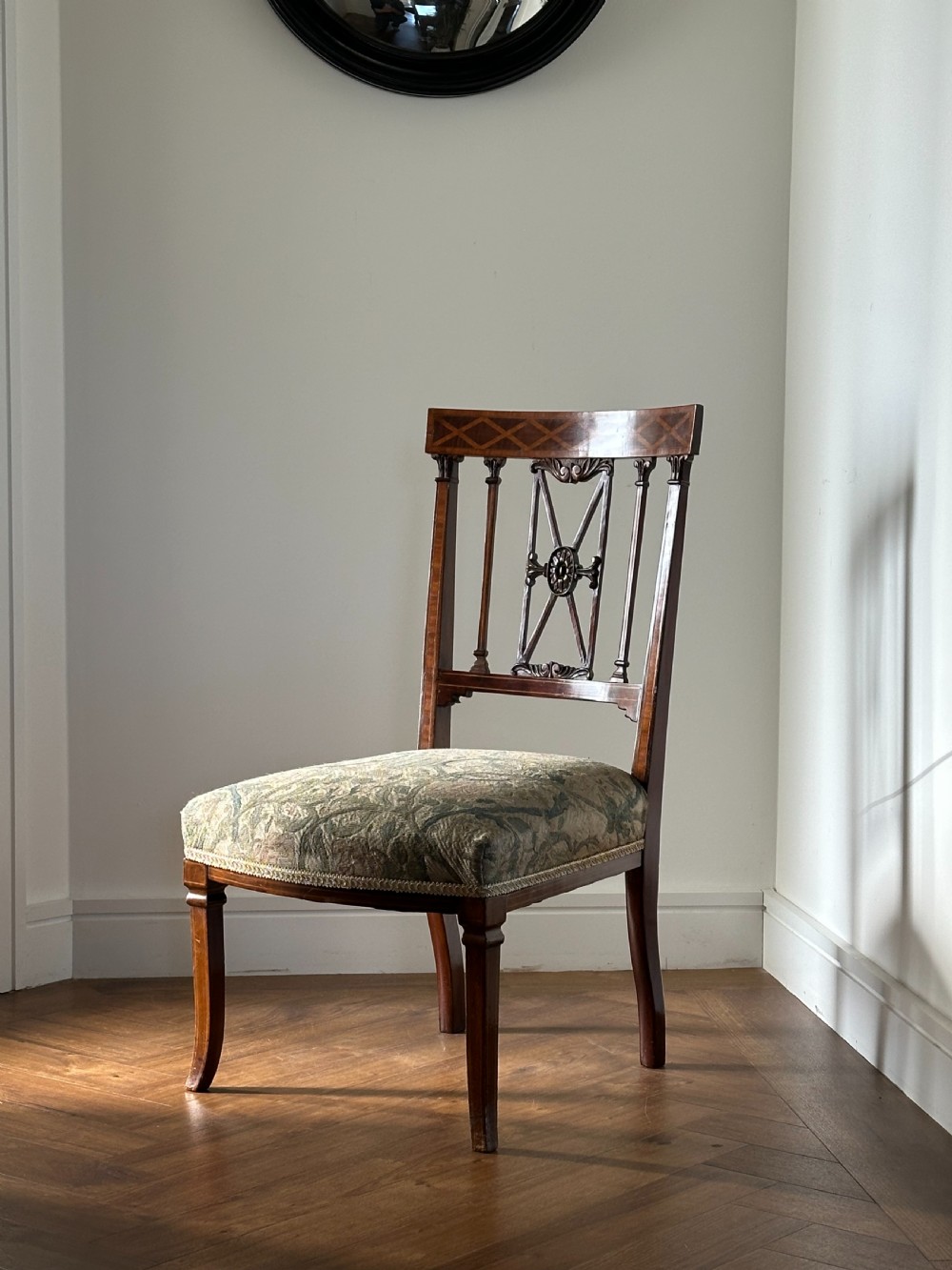 A fine pair of neoclassical low chairs in the manner of Collinson & Lock View VI