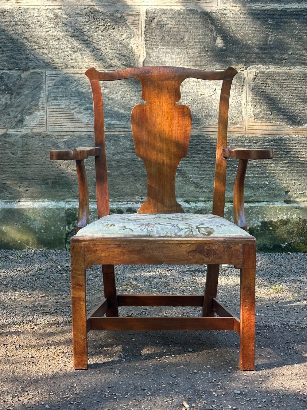 A Scottish George III walnut 'caqueteuse' elbow chair, third quarter 18th century