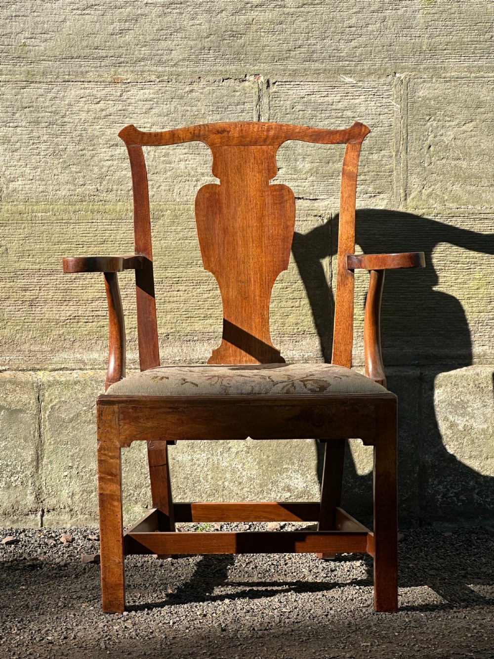 A Scottish George III walnut 'caqueteuse' elbow chair, third quarter 18th century View II