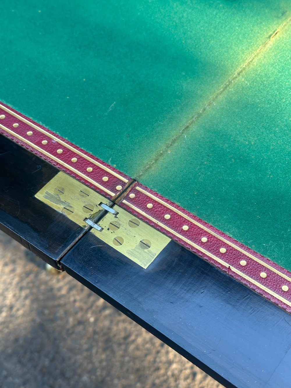 A late Victorian ebonised and parcel gilt card table with a green baize top and turned amboyna columns. View VII