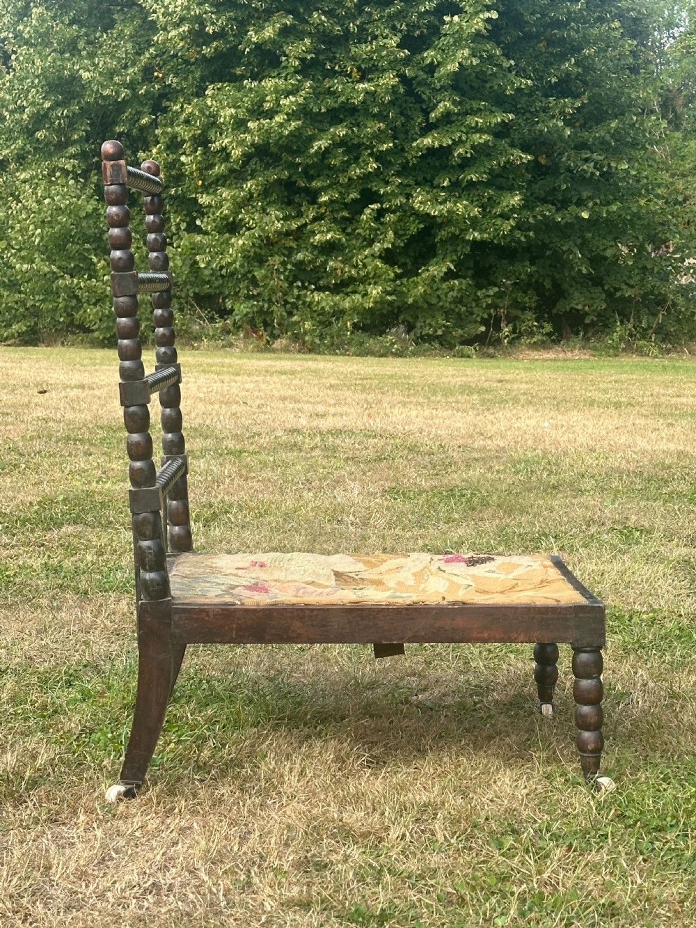 A 19th century ebonised bobbin chair, probably Scottish View II