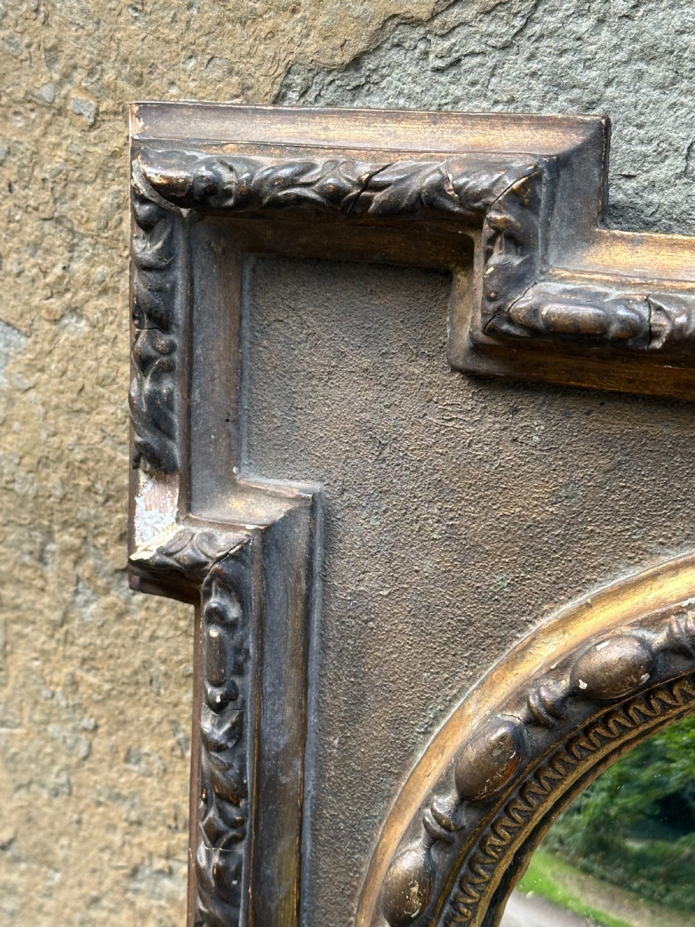 A late 19th-century square dark wood wall mirror featuring stepped architectural outer corners and a central gilt-trimmed circular convex mirror. View III