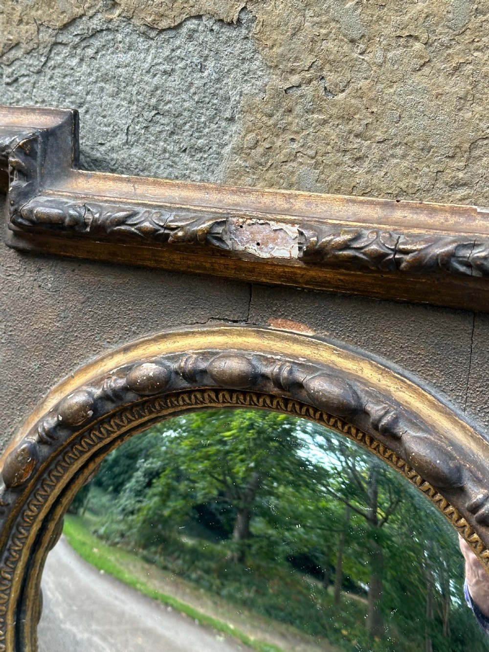 A late 19th-century square dark wood wall mirror featuring stepped architectural outer corners and a central gilt-trimmed circular convex mirror. View IV