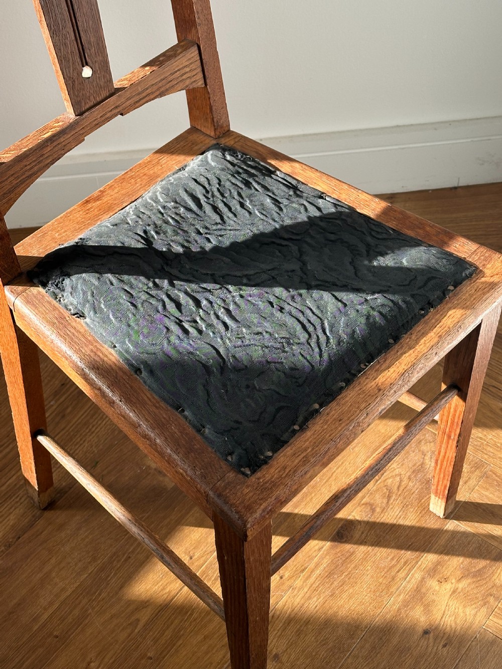 E. A Taylor (Scottish 1871-1951) A Glasgow School carved oak side chair View II