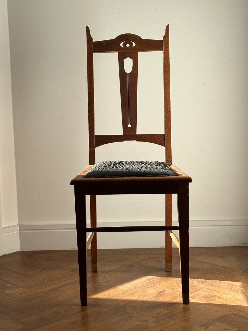 E. A Taylor (Scottish 1871-1951) A Glasgow School carved oak side chair