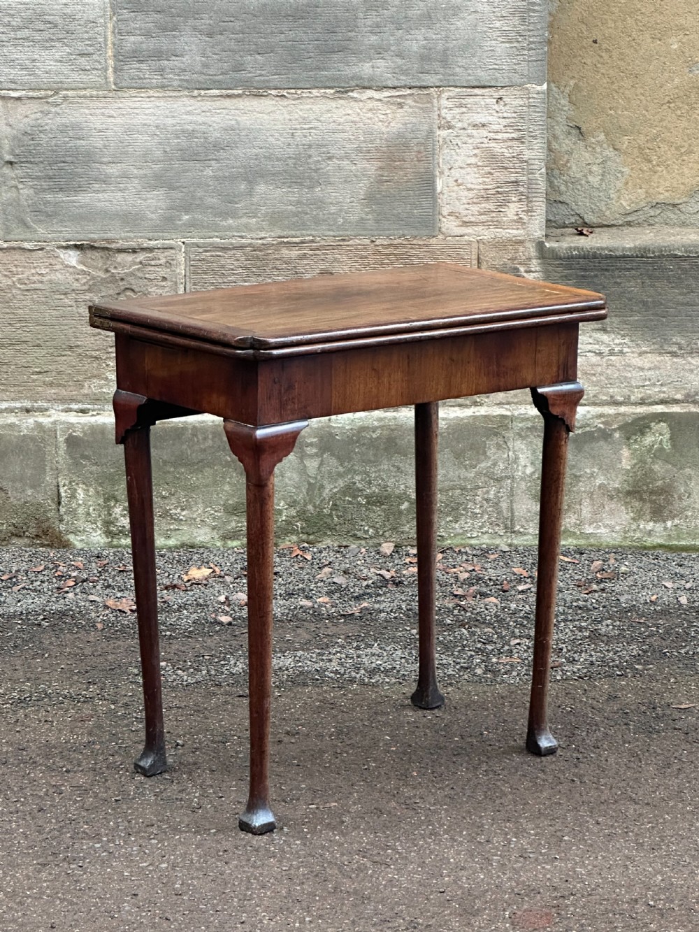 A George I walnut card table, probably Scottish or Irish, 1720's