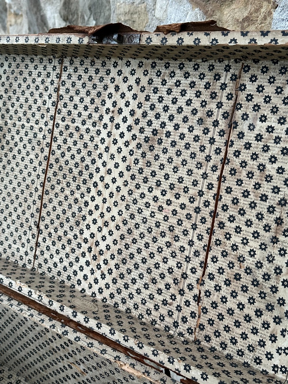 A late George III hide and metal bound travelling trunk featuring brass stud embellishments, iron corner brackets, and carrying handles. View VIII