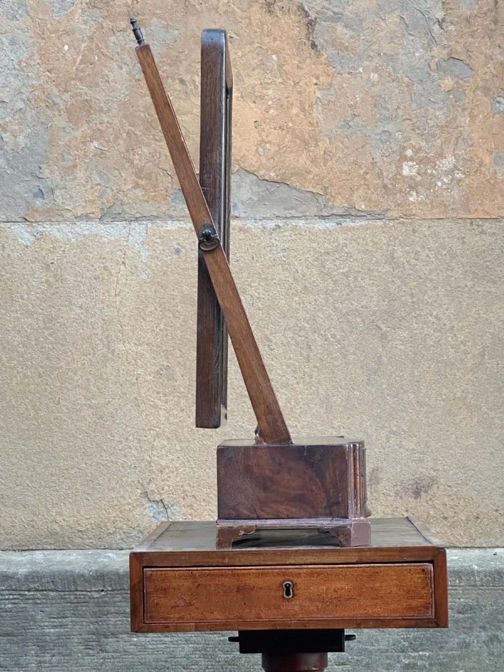 A mid-18th-century George II mahogany toilet mirror with a rectangular swing glass supported by side uprights above a drawers base. View V