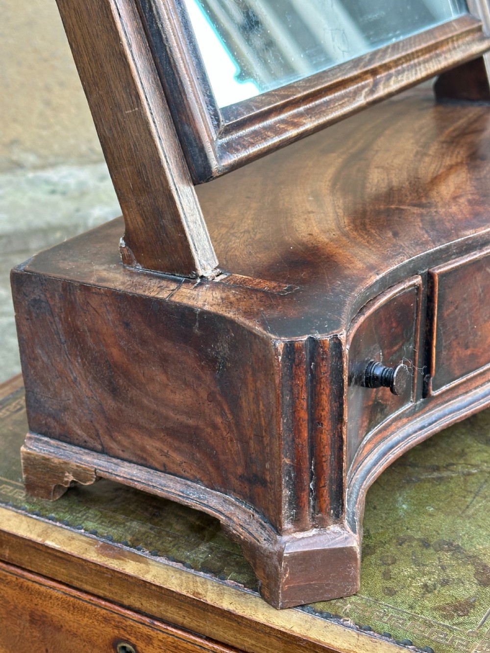 A mid-18th-century George II mahogany toilet mirror with a rectangular swing glass supported by side uprights above a drawers base. View X