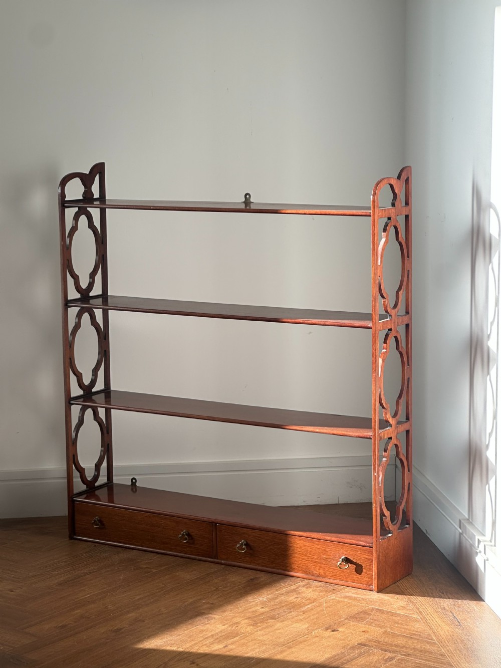A nice quality set of George III style mahogany hanging shelves View II