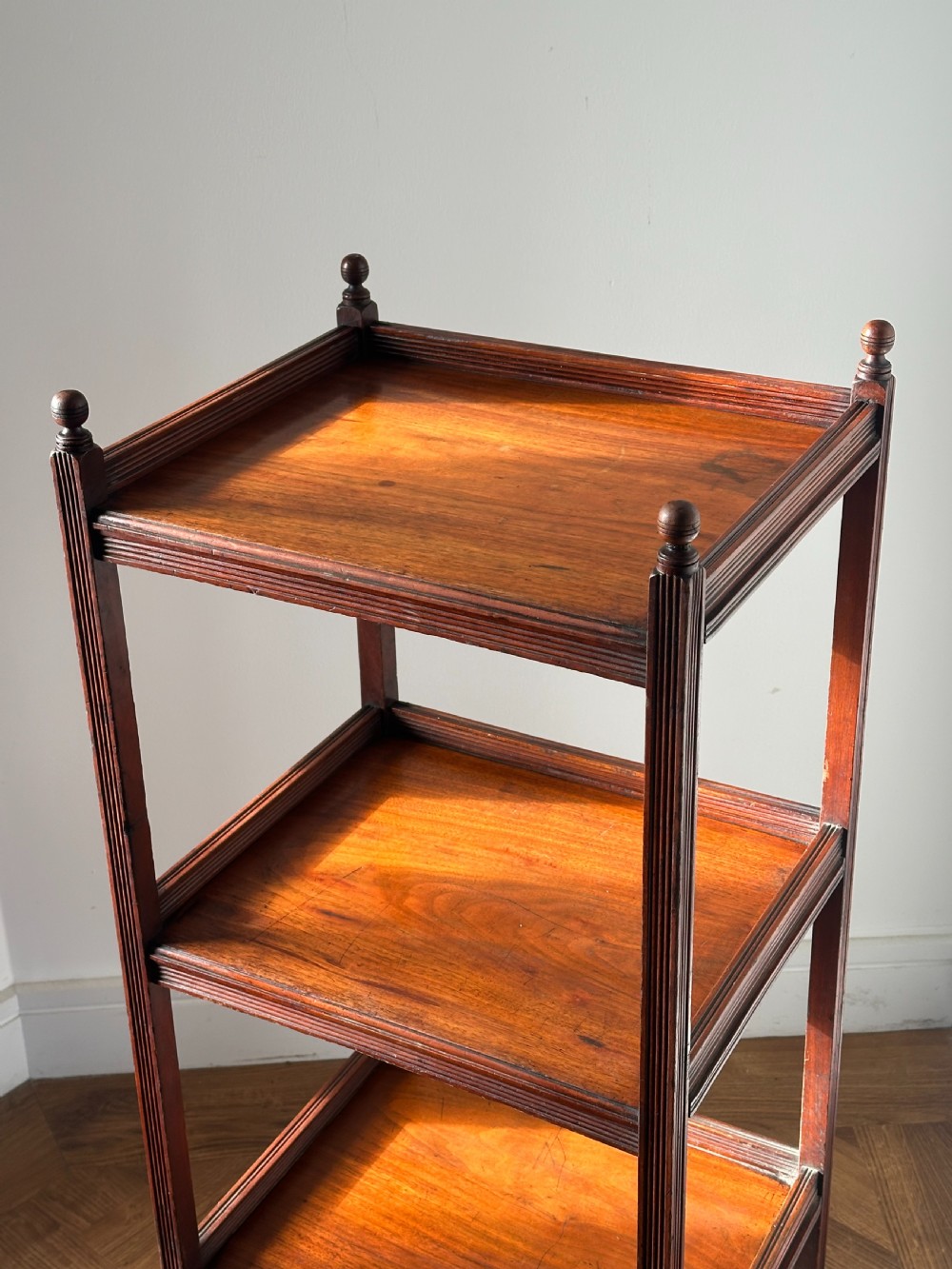 A walnut Aesthetic Movement three tier whatnot in the manner of E.W Godwin View XI