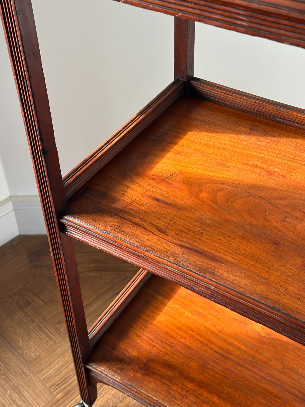 A walnut Aesthetic Movement three tier whatnot in the manner of E.W Godwin View III