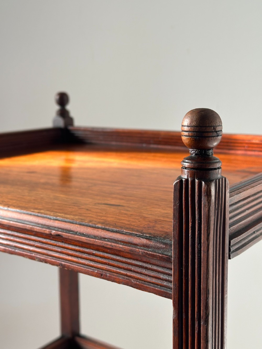A walnut Aesthetic Movement three tier whatnot in the manner of E.W Godwin View IV