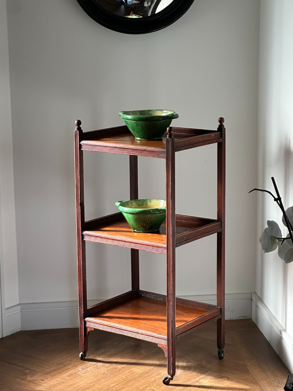A walnut Aesthetic Movement three tier whatnot in the manner of E.W Godwin View VI