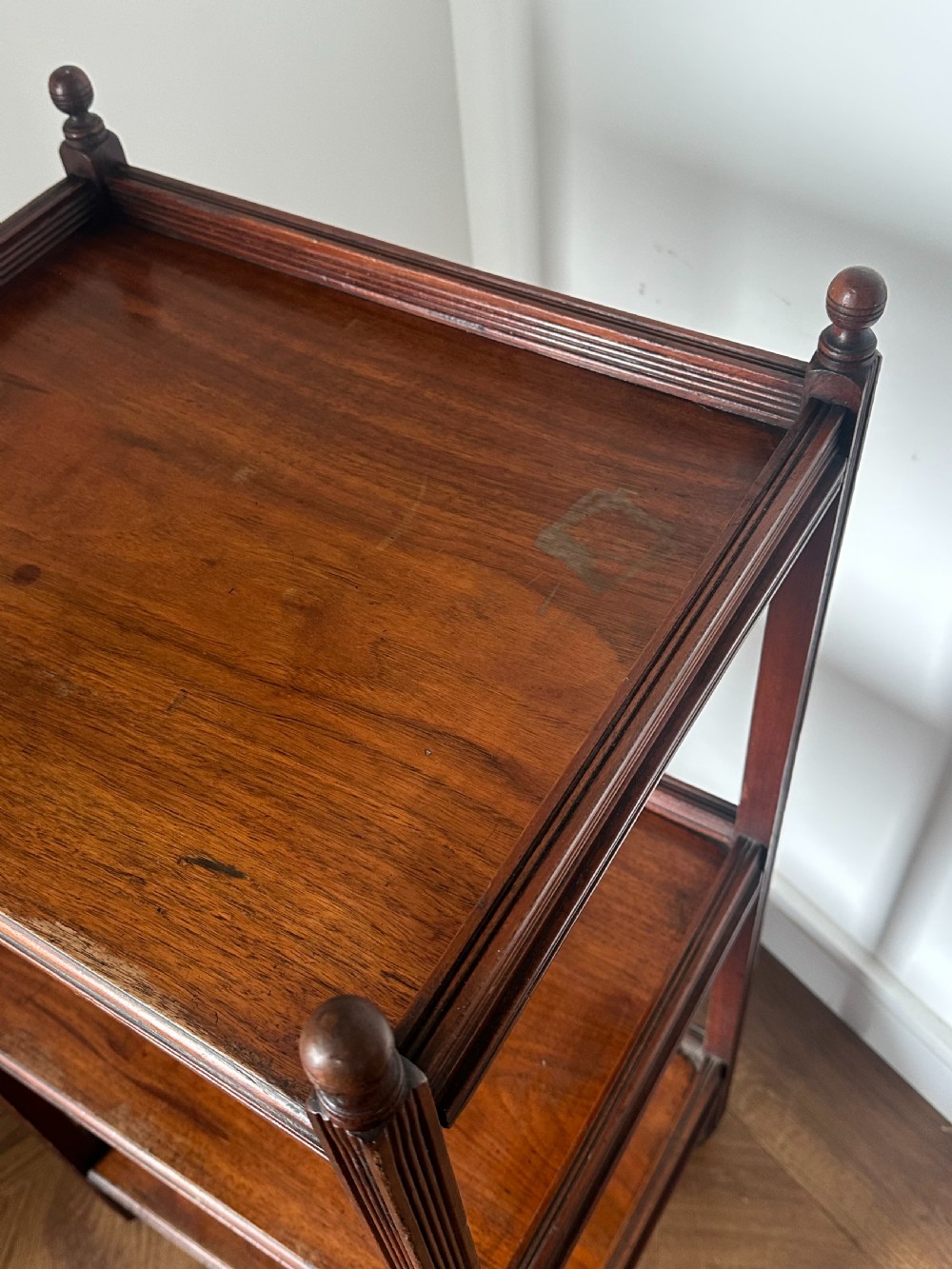 A walnut Aesthetic Movement three tier whatnot in the manner of E.W Godwin View IX