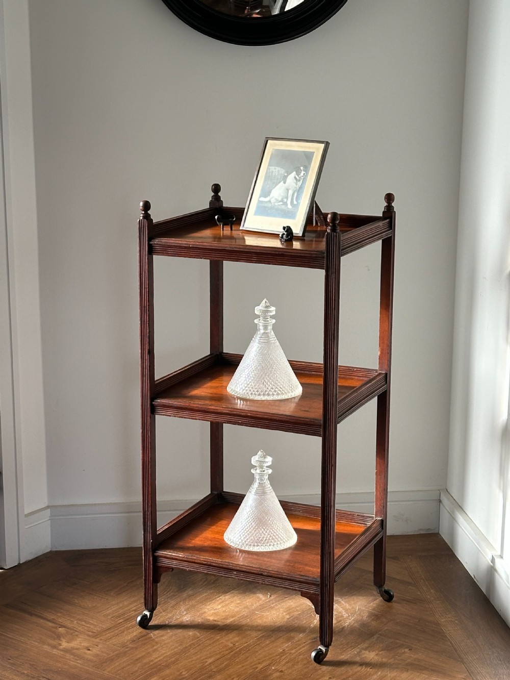 A walnut Aesthetic Movement three tier whatnot in the manner of E.W Godwin View X